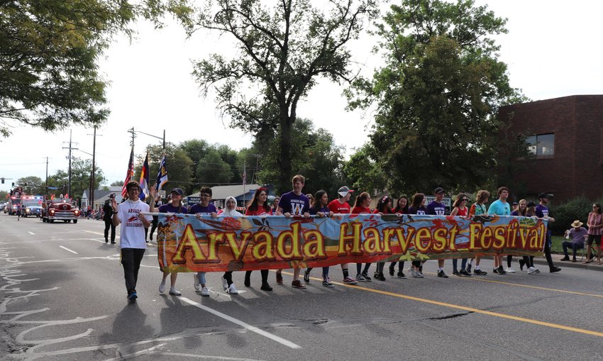 Students from Arvada High School and Arvada West High School lead the Arvada Harvest Parade down Ralston Road.